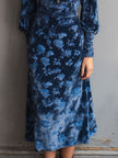FJØRNA retro turtleneck rose print velvet midi dress displayed on a hanger, featuring long sleeves and a fitted waist.