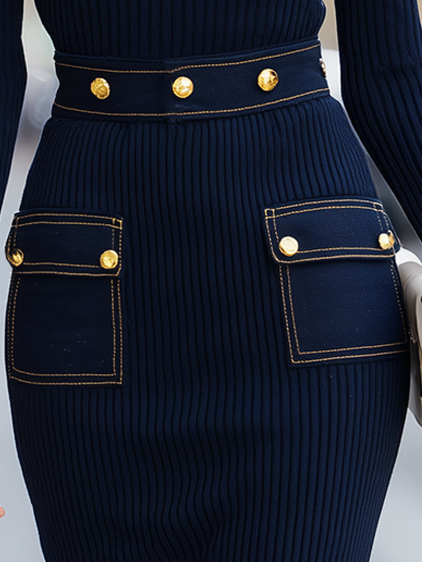 Navy ribbed knit dress by FJØRNA featuring gold-tone buttons and denim pocket details, perfect for casual women’s fashion.