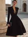 FJØRNA deep V tuxedo-inspired midi dress with tailored fit and sleek design, shown on a model.