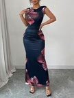 FJØRNA white sleeveless bodycon maxi dress with contrast color flower print and round neckline, stylish and elegant for summer wear.