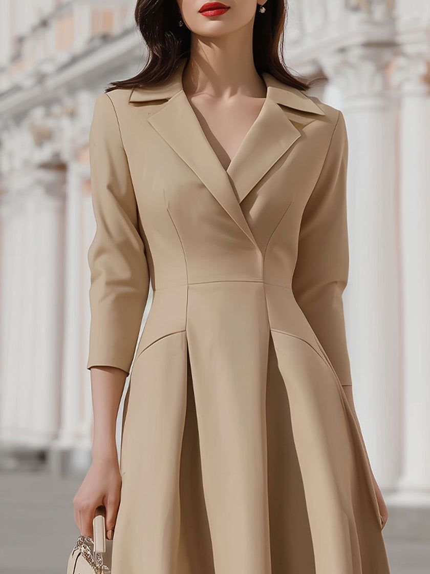 Beige blazer-style midi dress by FJØRNA, featuring a tailored blazer design, knee-length cut, and elegant fit.