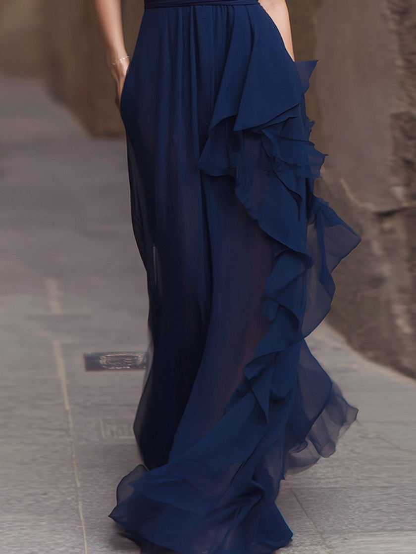 Navy deep V-neck ruffled chiffon maxi dress by FJØRNA, flowing design with ruffle details and elegant length.