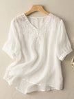 FJØRNA women's summer linen blouse with V-neck, flowy and casual, perfect for warm weather and relaxed styles.
