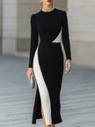 FJØRNA modern black and white asymmetric color-block midi dress with stylish design and elegant fit, displayed on a model.