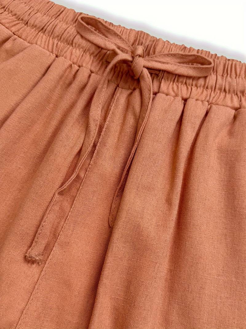 FJØRNA women's lightweight summer trousers with relaxed fit, drawstring waist, and side pockets, perfect for casual wear.