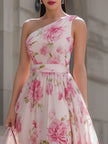 Pink floral one-shoulder chiffon midi dress by FJØRNA featuring a flowing fabric and elegant design.