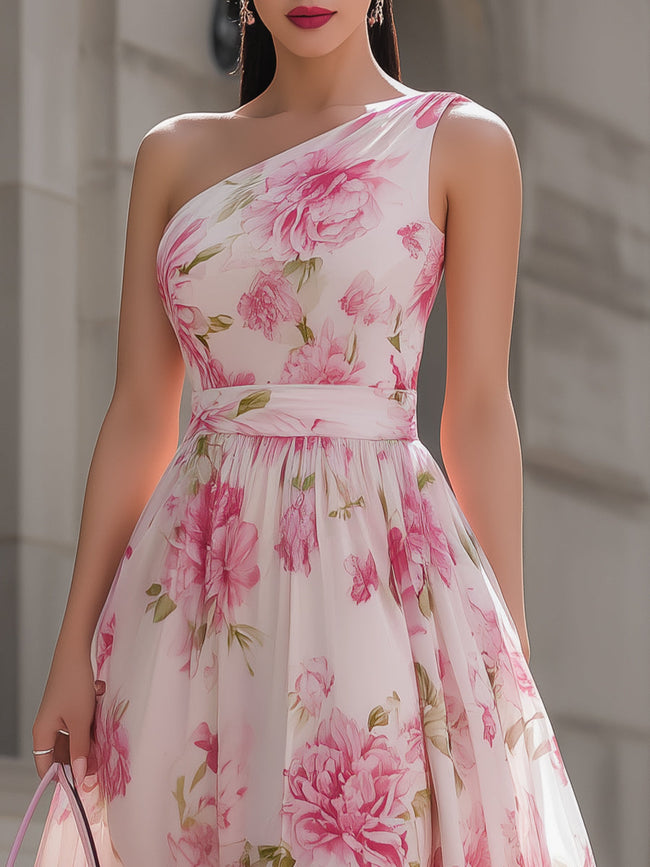 Pink floral one-shoulder chiffon midi dress by FJØRNA featuring a flowing fabric and elegant design.