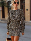 FJØRNA leopard print long-sleeve tailored mini dress displayed on a model, featuring a fitted silhouette and classic leopard pattern.