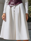 White shirt dress by FJØRNA with a wine-red sculpted leather corset, structured two-piece set, featuring a tailored, elegant design.