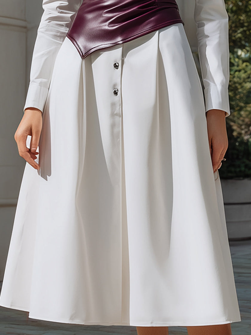 White shirt dress by FJØRNA with a wine-red sculpted leather corset, structured two-piece set, featuring a tailored, elegant design.
