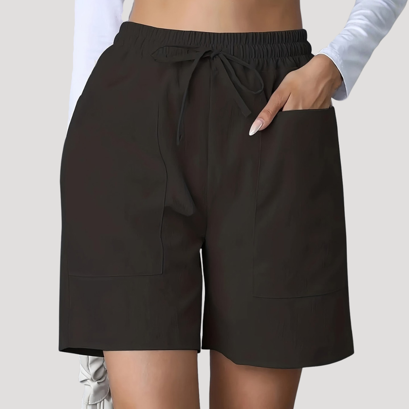 FJØRNA women's lightweight summer shorts with wide leg fit, drawstring waist, and side pockets, relaxed and comfortable for warm weather.
