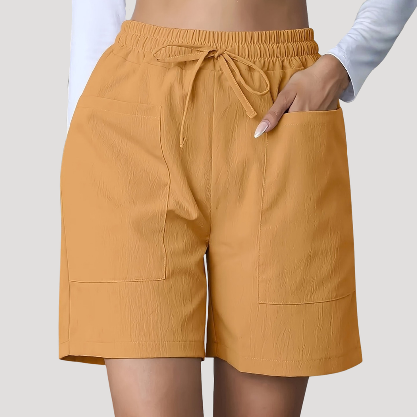 FJØRNA women's lightweight summer shorts with wide legs, drawstring waist, and side pockets, perfect for casual warm-weather wear.