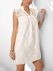 White lace mini dress by FJØRNA, casual summer wedding dress with a fitted silhouette and delicate lace details.