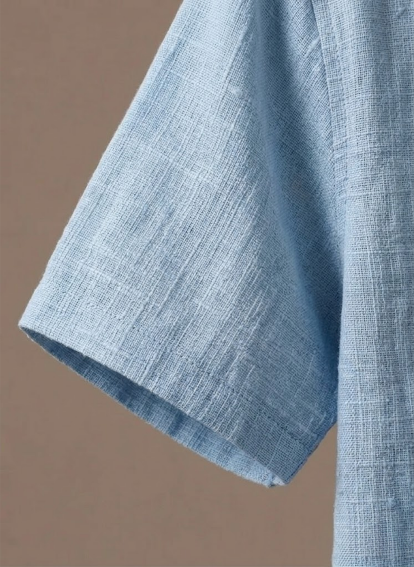 Men's linen beach shirt by FJØRNA, lightweight and breathable summer polo, button-up style perfect for warm weather.