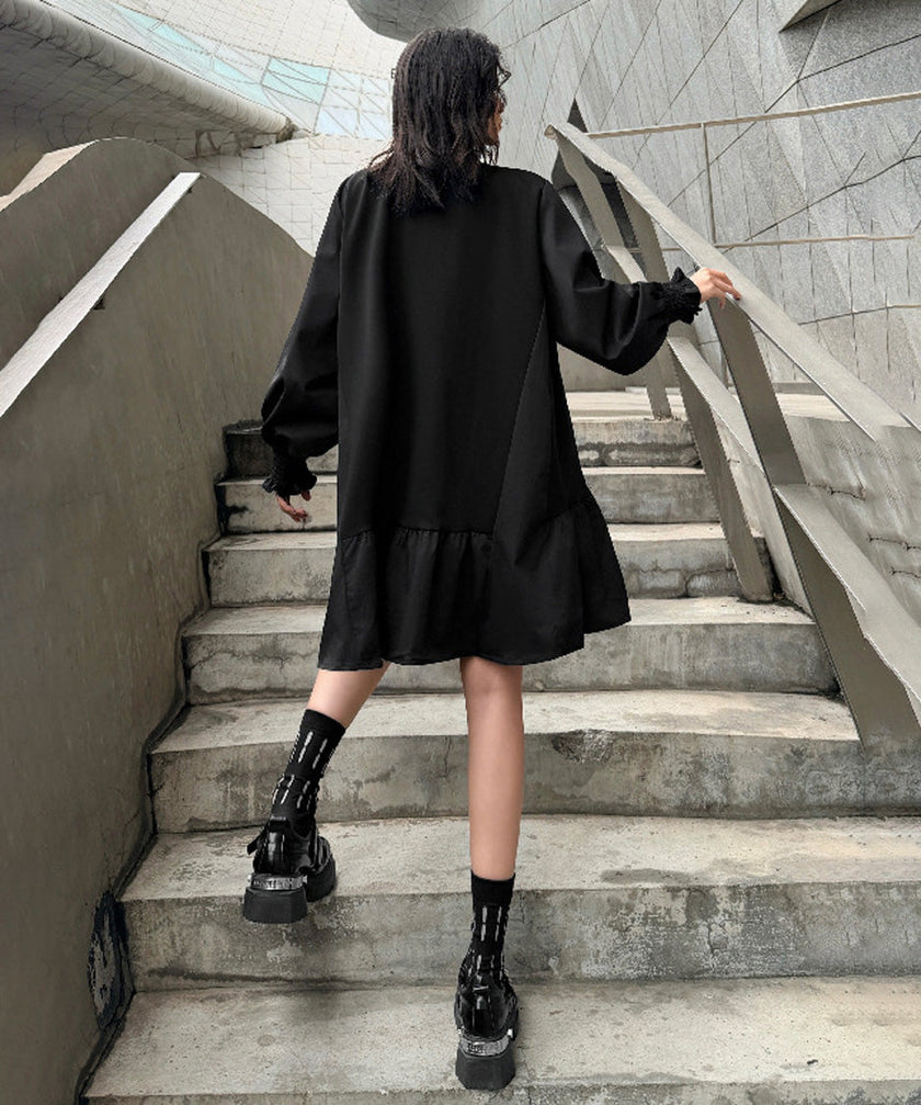 White FJØRNA volume flare dress with puffed sleeves and a fitted waist, styled for a chic, feminine look.
