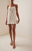 FJØRNA Blanc Rosette-detailed Georgette Mini Dress showing delicate rosette embellishments and flowing georgette fabric.