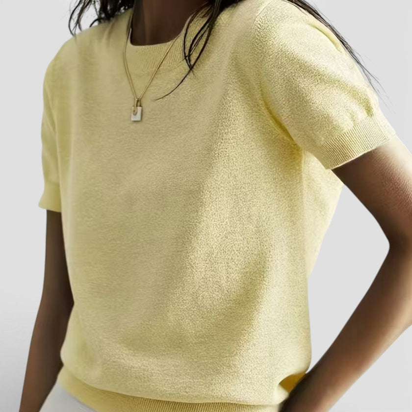 Women's FJØRNA knit top in wool blend, comfortable classic fit, shown in a cozy, stylish design suitable for casual wear.