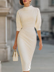 Cream FJØRNA turtleneck puff-sleeve midi dress with short sleeves, showcasing a stylish, elegant midi-length design.