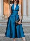 FJØRNA halter V-neck pleated midi dress for women, showcasing a flowy design with a V-neckline and pleated fabric.