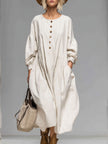FJØRNA cotton button-front midi dress for women, featuring a classic design with a fitted waist and knee-length hem.
