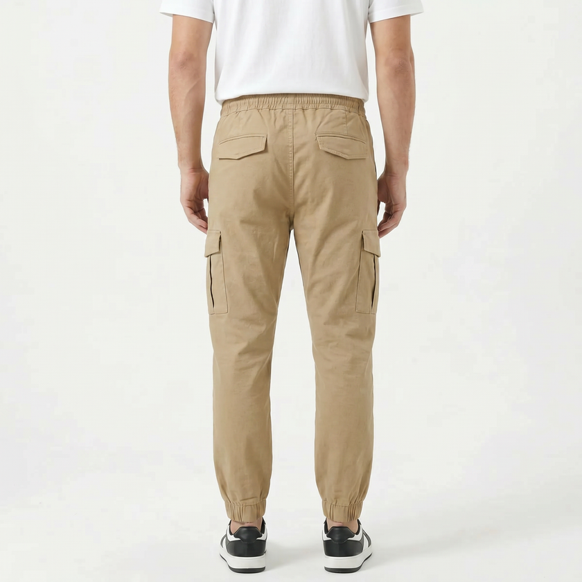 Men's slim fit cotton cargo trousers by FJØRNA, featuring multiple pockets and a tailored fit in classic khaki color.