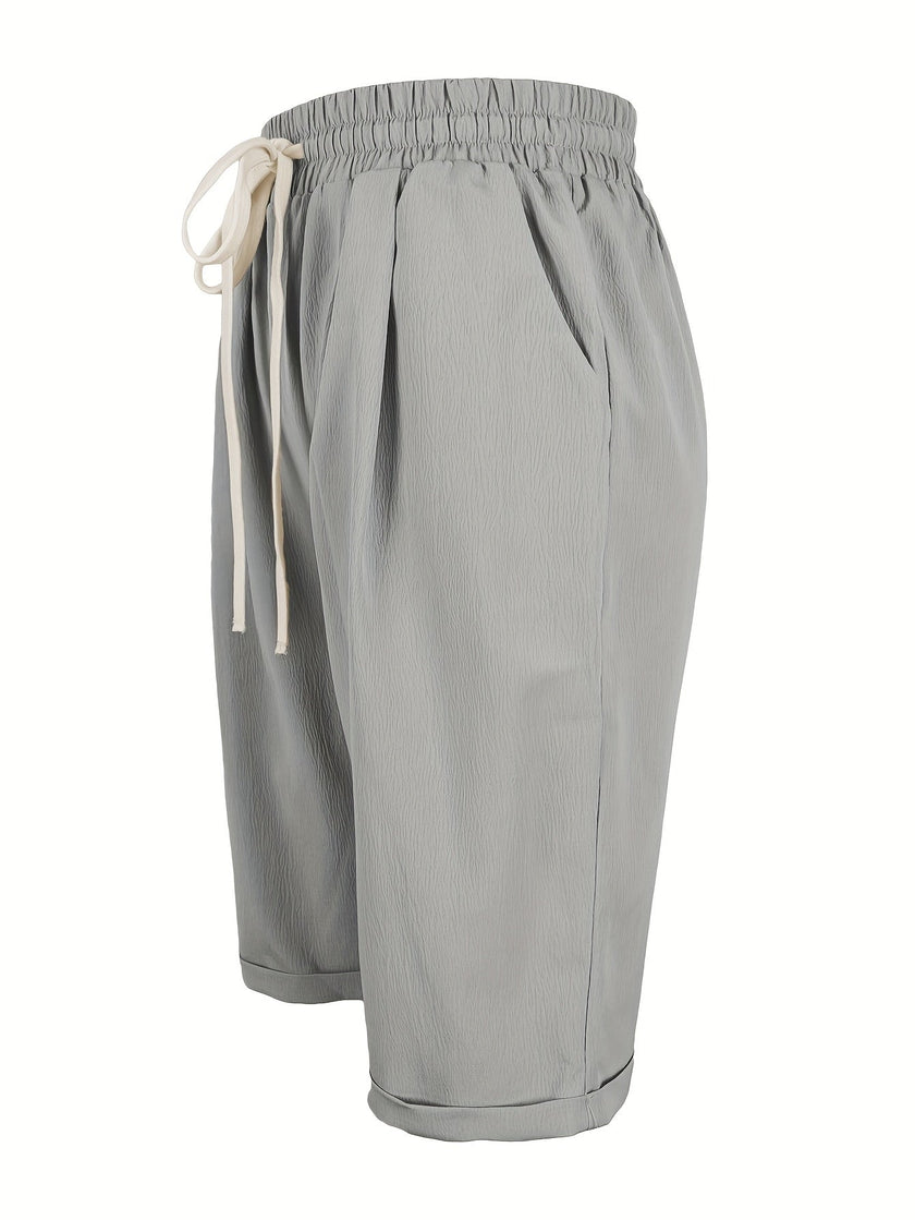 FJØRNA women's lightweight summer Capri pants with relaxed fit, drawstring waist, and breathable fabric for comfort.