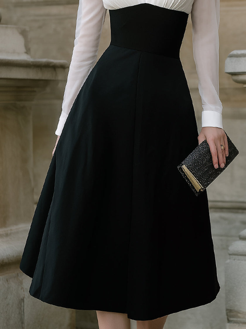 FJØRNA contrast bodice A-line midi dress with sheer sleeves, elegant design, and flowing fabric for women.