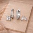 FJØRNA unisex piercing set accessories for women, featuring multiple metal earrings and nose studs in a variety of styles.