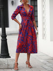 White FJØRNA elegant shirt dress displayed on a hanger, showcasing a classic collar, button front, and flowing fabric.