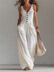 White sleeveless FJØRNA wide-leg jumpsuit with patch pockets, flowing fabric and a relaxed fit.