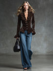 FJØRNA Cocoa Brown Velvet V-Neck Ruffled Long Sleeve Blouse with ruffle details and soft velvet fabric, displayed on a hanger.