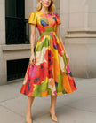 Red satin midi dress for women by FJØRNA featuring an A-line silhouette, pleated design, and puff sleeves.
