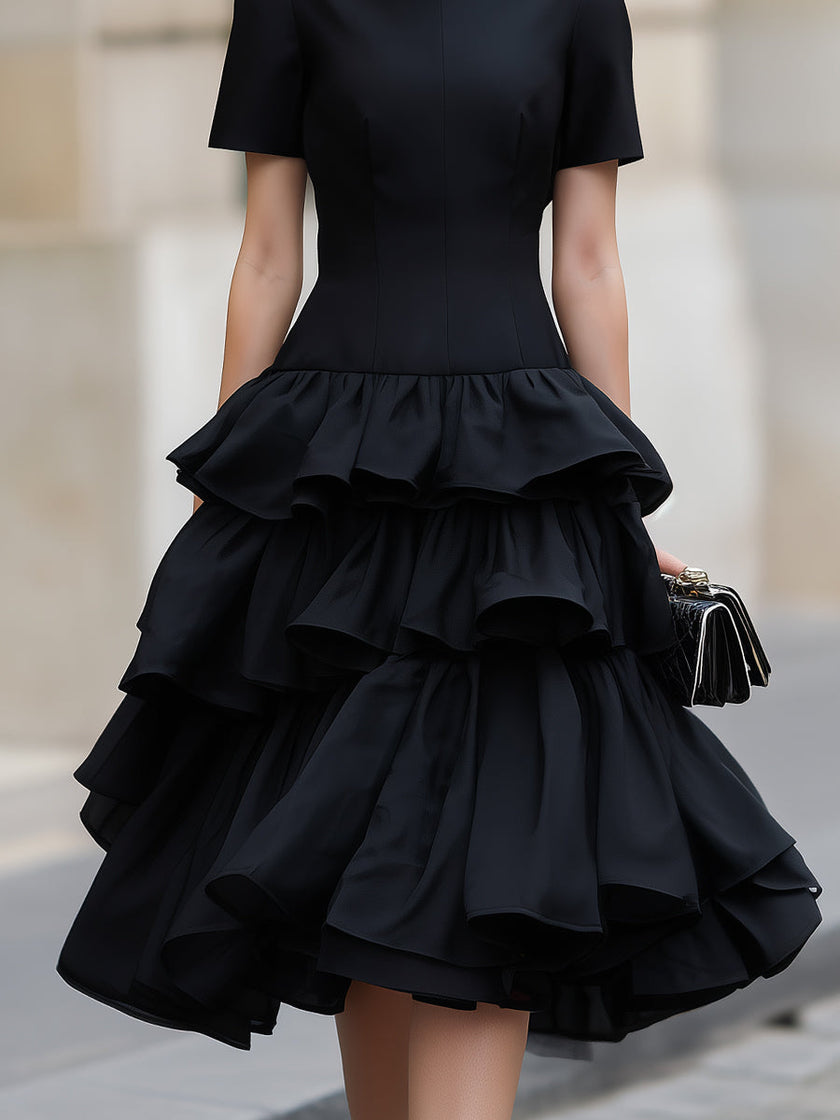 FJØRNA high neck tiered ruffle midi dress with layered fabric and elegant design, perfect for stylish occasions.
