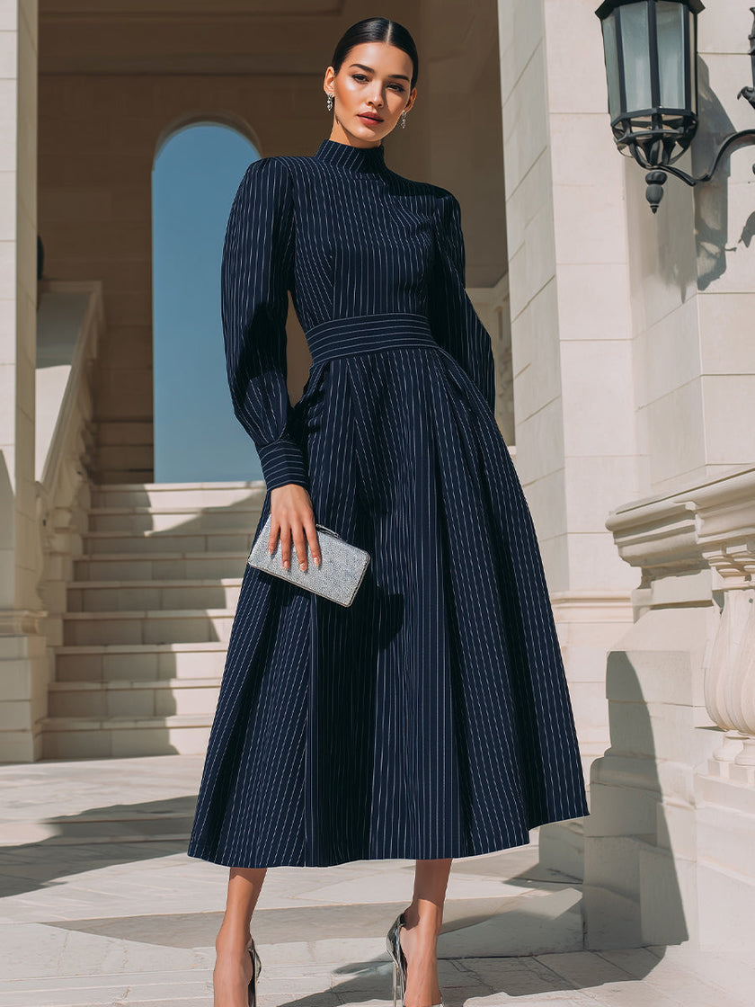 FJØRNA high-neck pinstripe midi dress for women featuring a structured waist and classic midi length, stylish and elegant.