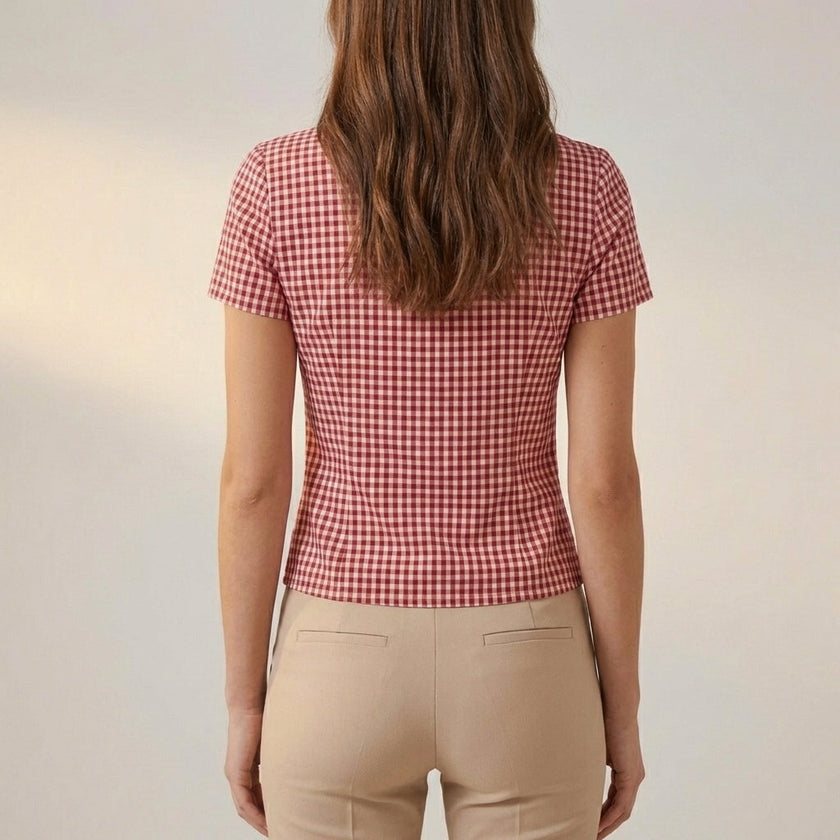 Back view of a FJØRNA women’s summer gingham V-neck blouse, lightweight top with short sleeves and classic checkered pattern.