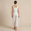 FJØRNA women's two-piece co-ord set with button-front square neck top and matching pants, viewed from the back.