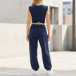 FJØRNA contemporary two-piece wrap-front cropped top and relaxed joggers set, shown from the back with stylish, comfortable design.