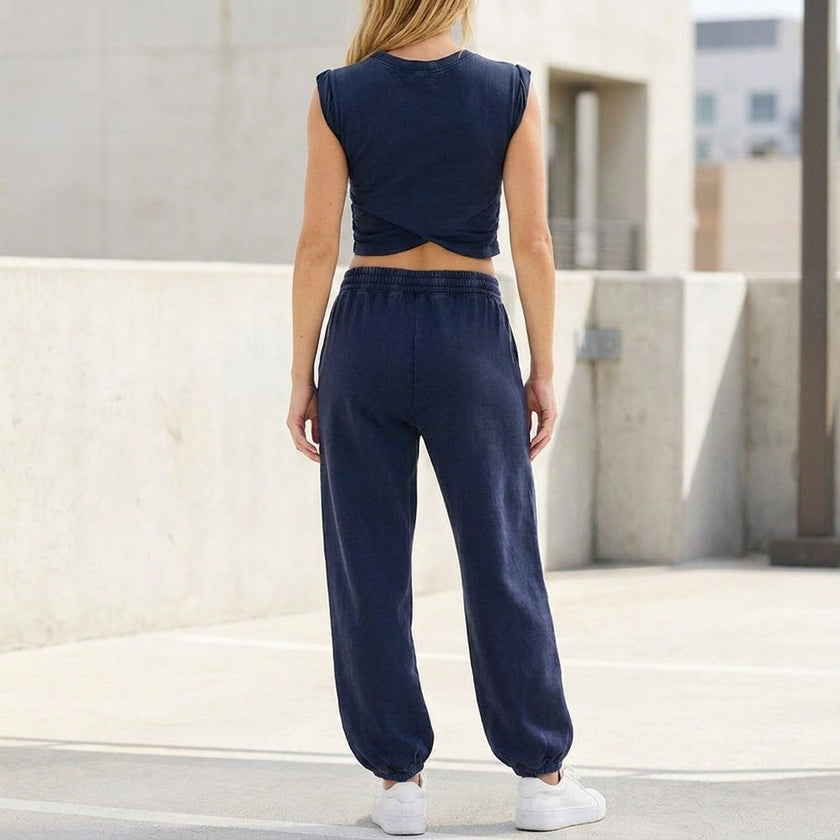 FJØRNA contemporary two-piece wrap-front cropped top and relaxed joggers set, shown from the back with stylish, comfortable design.