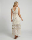 FJØRNA bohemian lace maxi dress with tiered skirt and tassel waist, back view showcasing intricate lace details and flowing design.