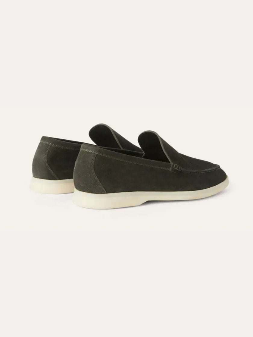 Men's dark green suede moccasins slippers by FJØRNA, showing the back view with stitching and soft suede material.