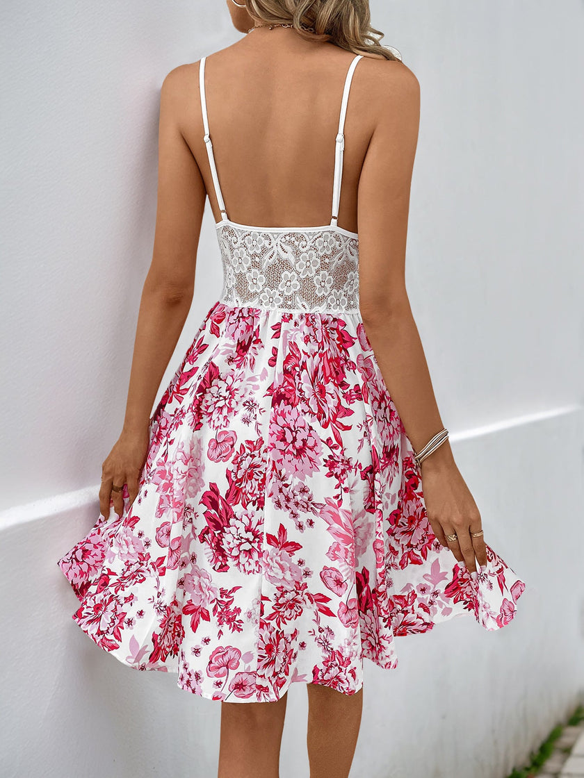 FJØRNA sleeveless white sundress with cutout details and a flared hem, shown from the back with lace floral fabric.