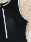 Women's FJØRNA sporty high neck zip swimsuit, elegant and functional swimwear with a high neckline and zipper detail.