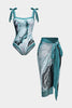 Women's abstract print swimsuit set with pareo by FJØRNA, includes strappy top and matching swim skirt on a model.