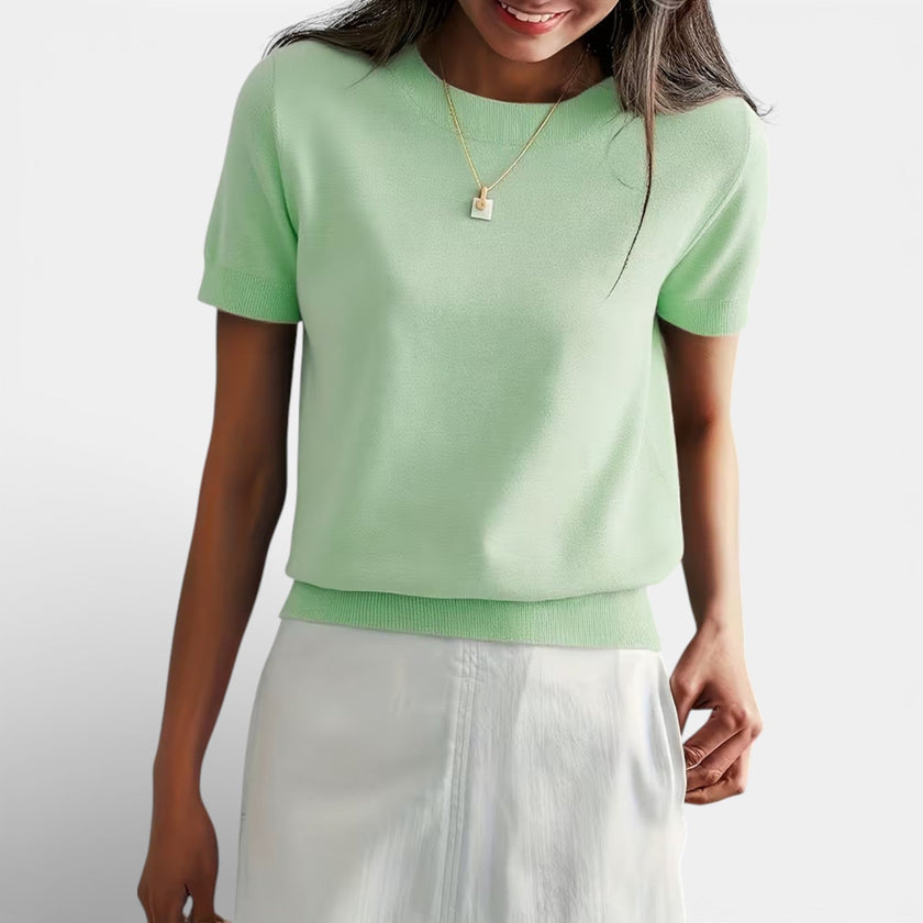 Women's FJØRNA wool blend knit top showing classic fit and comfortable design, with long sleeves and textured fabric.