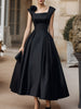 FJØRNA square neck structured midi dress with floral shoulder accents, showcasing a fitted silhouette and elegant design.