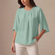 Bean green pleated summer blouse for women, casual top by FJØRNA, featuring a relaxed fit and lightweight fabric.