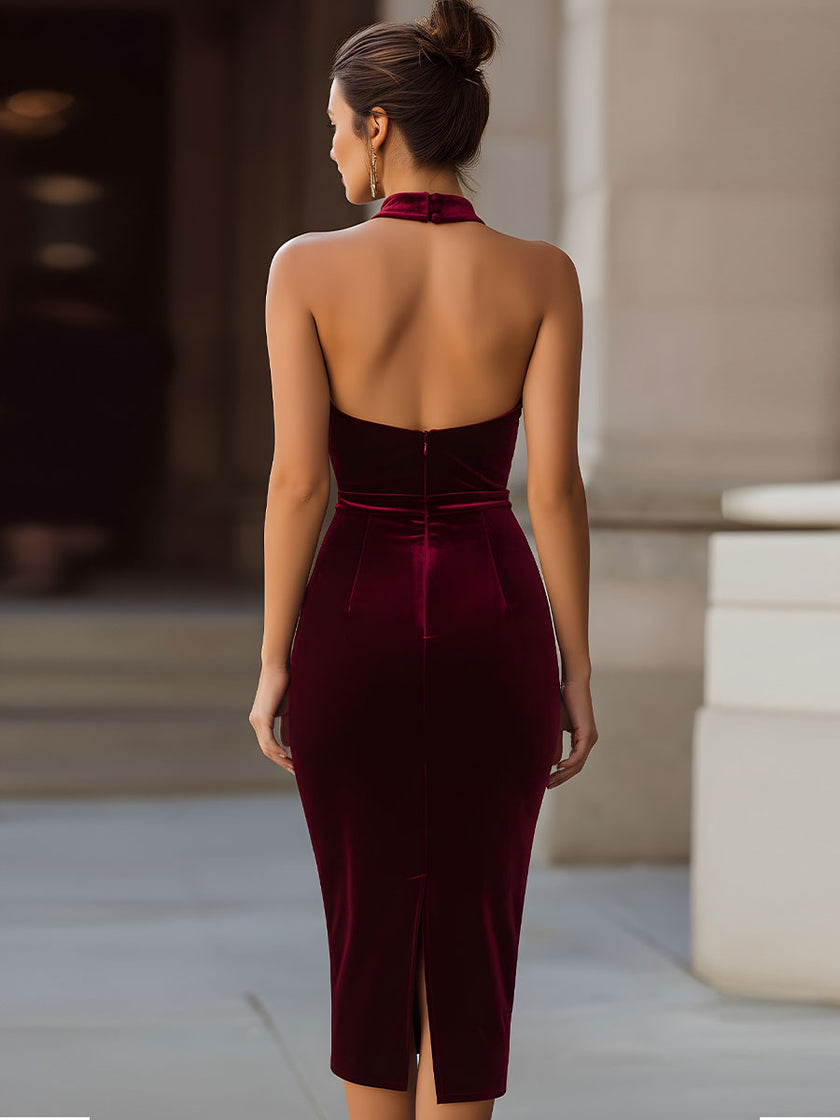 FJØRNA rich burgundy velvet halter-neck bodycon midi dress, form-fitting with a sleek design and elegant midi length.