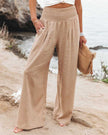 Beige lightweight summer trousers for women by FJØRNA, wide-leg flowy and breathable for a comfortable summer look.