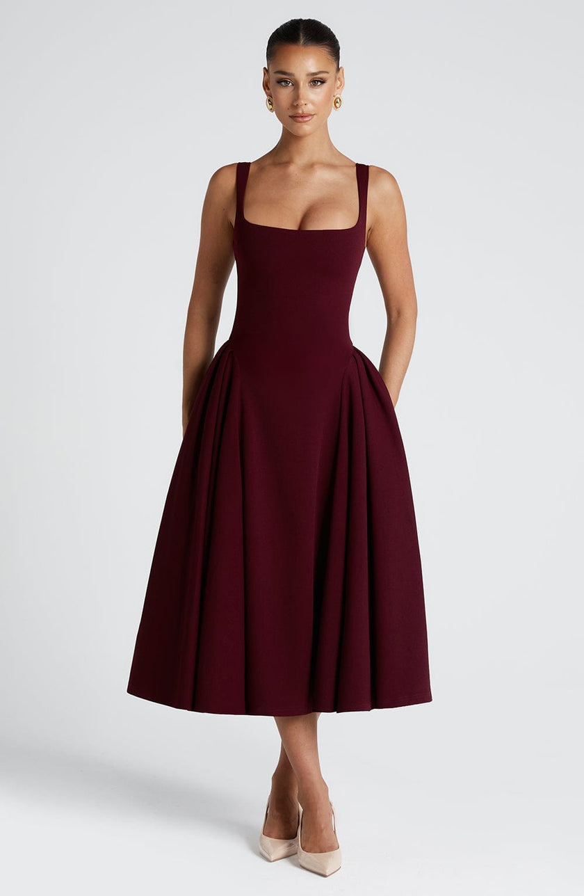 FJØRNA Betty Cherry Laca Midi Dress in white, elegant midi-length dress with glossy cherry-red finish, perfect for stylish occasions.