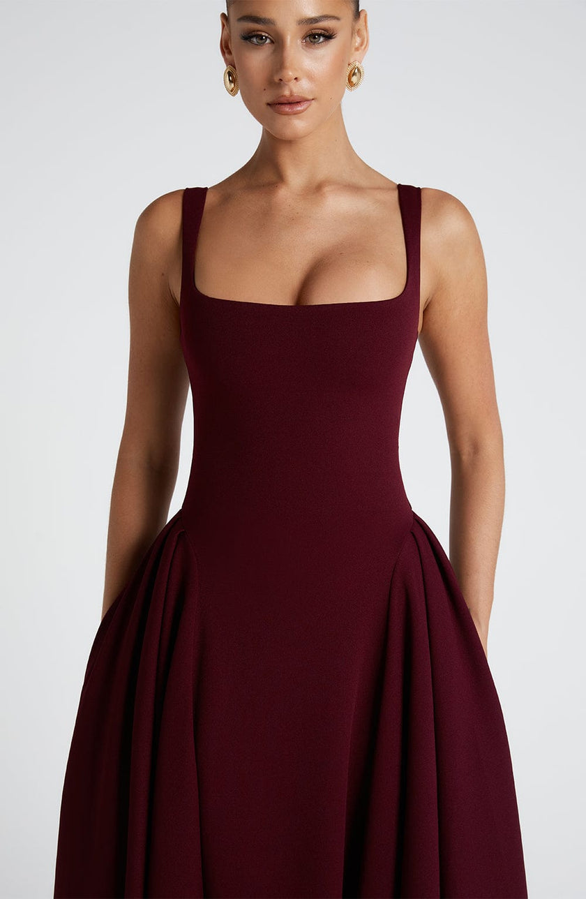 FJØRNA Betty Midi Dress in cherry lacquer finish, white midi length dress with sleek, elegant design and fitted silhouette.